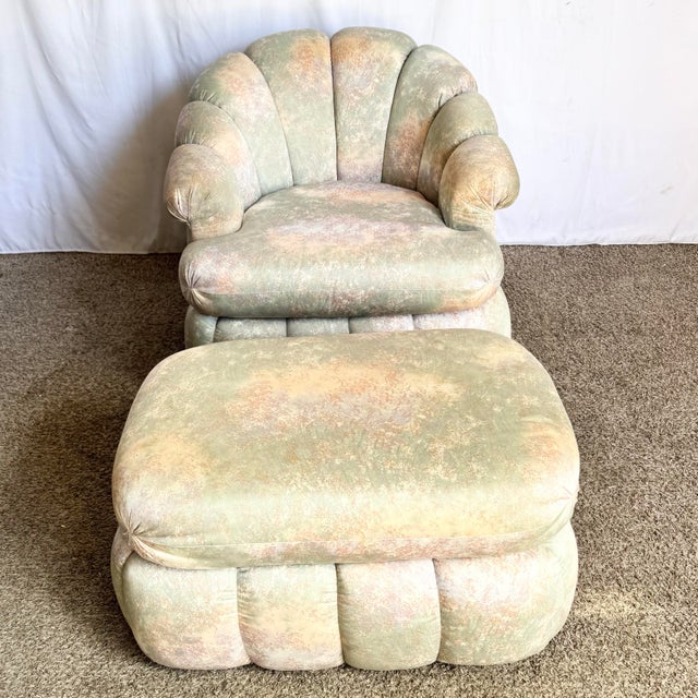 This postmodern clam shell swivel lounge chair with matching ottoman offers plush, sculptural comfort wrapped in softly...