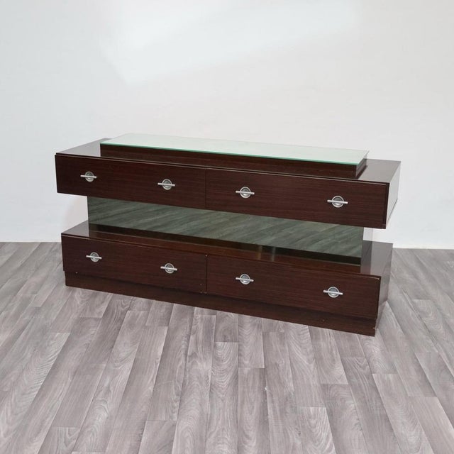 An elegant Macassar Ebony chest of drawers, crafted in the 1980s, featuring a refined cubic design with clean,...