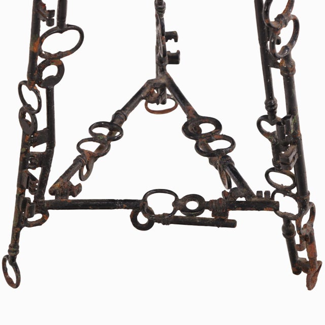 An exceptional pair of artist-made stools dating to circa 1960, handcrafted from forged iron and solid oak. The sculptural...