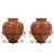 The vessels display the rustic character and craftsmanship associated with traditional Spanish pottery, featuring warm...