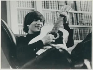 John Lennon with Guitar, 1970s, Black and White Photograph