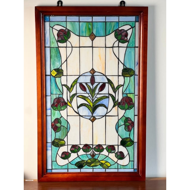 This beautiful vintage stained glass panel has a wonderfully elegant Art Nouveau inspired design, combining flowing...