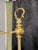 This brass bridge floor lamp reflects the popular lighting designs of the early 20th century, specifically the Art Deco...