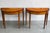 Elegant pair of American Federal Revival mahogany demilune console tables, dating to the mid-20th century, distinguished...
