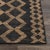 Black cotton rug with natural jute tribal pattern woven in a unique serpentine style. Please note that its appearance may...