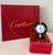 Cartier Vendome “Trinity” Travel Alarm Clock, Black Enamel & Tri-Color Gold, France, circa 1990s A refined and highly...