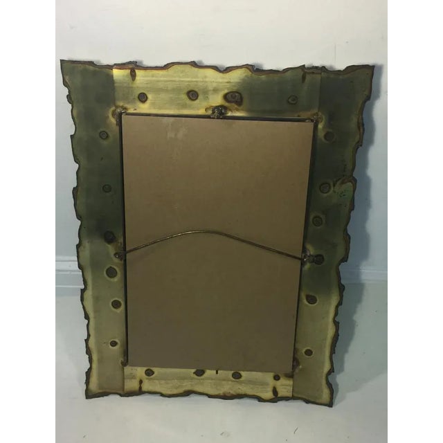 Brutalist Mirror Comprised of Rugged Abstract Torch Cut Metal Pieces in a Rectangular Frame .Designed in the 1970's this...