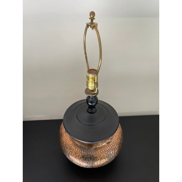 One of a kind table lamp made from a Persian copper bowl and an Asian-style stand. A truly unique piece from the estate of...