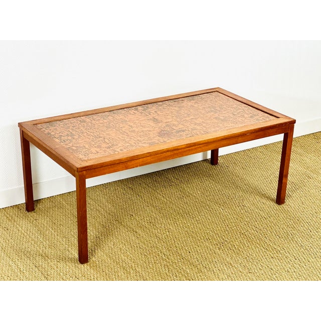 A stunning rectangular coffee table with a simple yet elegant design, typical of 1960s scandinavian production. the frame...