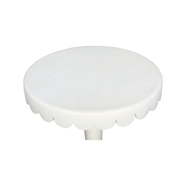 Crafted from natural wood, this scalloped accent tables add a joyful pop of color and character to any space. The softly...