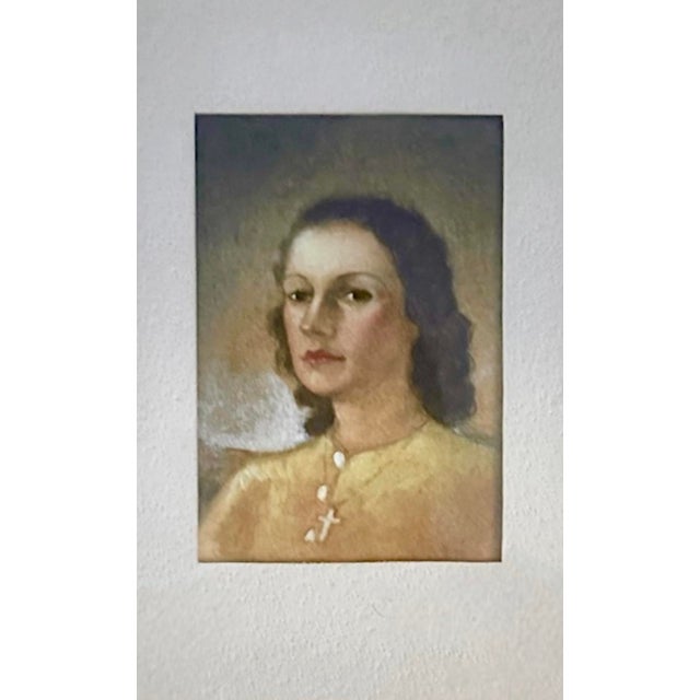 A lovely, petite framed watercolor portrait. Features an original, watercolor portrait of a brunette woman in a yellow,...