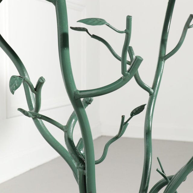 Organic tree form metal table hand painted green with distressing.