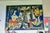The Net Mender by the renowned mid-20th-century French artist, this colorful textile artwork depicts the daily life of a...