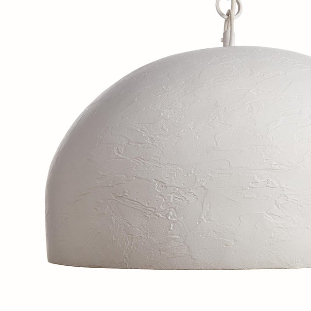 A modern statementworthy pendant with a lightly pounded textured metal dome shade. Finished in an ontrend matteWhite, this...