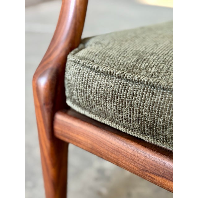 A refined example of American mid-century studio craftsmanship, this open-frame walnut armchair exemplifies the elegant...