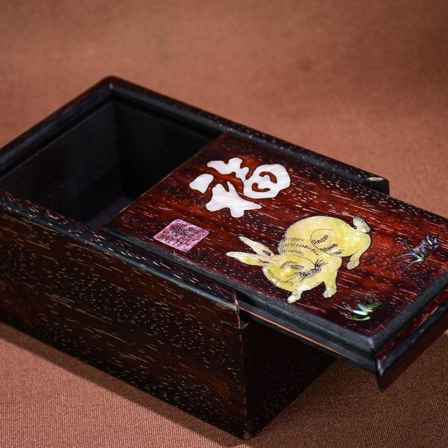 This is a charming and cleverly designed vintage jewelry or keepsake box, crafted from Zitan wood (purple sandalwood) with...