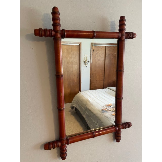A stunning hand crafted and hand turned French Faux Bamboo Wooden Wall Mirror from the early 1900's (1900-1910). These...