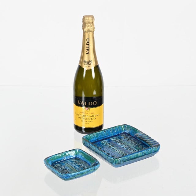 Wonderful and very rare pair of square-shaped ceramic ashtrays in the iconic glazed “rimini blu” color. These stylish...