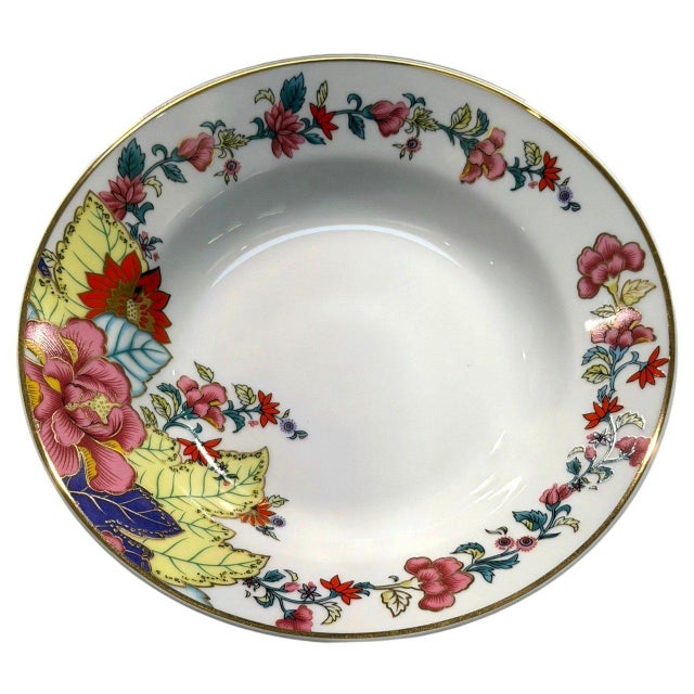 Imperial Leaf rimmed soup bowl featuring a colorful Tobacco Leaf-inspired floral pattern with large pink blossoms, yellow...