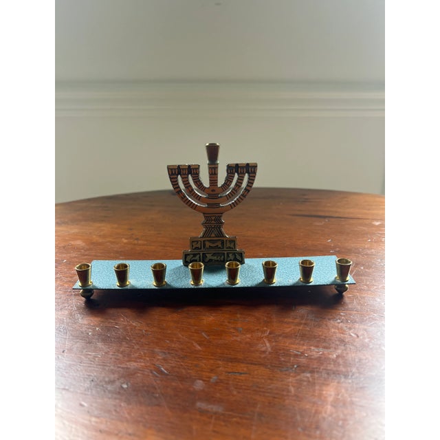 This vintage menorah by Oppenheim Israel is perfect for anyone who prefers a petite menorah. Inscribed with Hebrew, this...