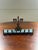 This vintage menorah by Oppenheim Israel is perfect for anyone who prefers a petite menorah. Inscribed with Hebrew, this...