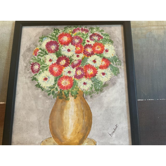 That’s a lovely still-life painting — the artist’s use of warm golds and vivid reds gives the bouquet a cheerful, almost...