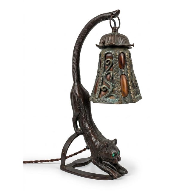 A stunning and substantial accent lamp featuring a heavy cast iron base in the form of a stretching cat. Unlike common...