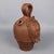 Fantastic vintage collectible jug/flask, made of terracotta and decorated with a human face in relief. The work has marked...