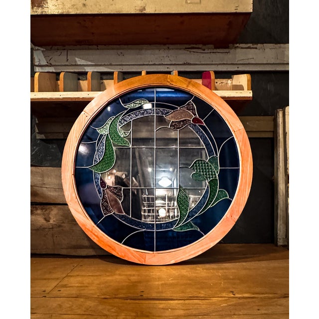 A beautiful, large, round stained glass window in beautiful condition. (The stained glass window itself measures 31.5".)