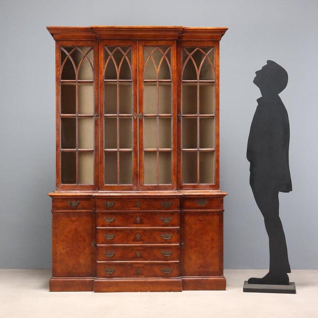 English-style oak bookcase. The front features a four-door glass shelf, while the lower section features three drawers in...