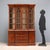 English-style oak bookcase. The front features a four-door glass shelf, while the lower section features three drawers in...