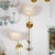 Brass Pair of modern single-arm torch style sconces For Sale - Image 8 of 11