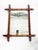 French wall mirror dating from the 1960s, featuring a decorative wooden frame designed to imitate bamboo. The rectangular...