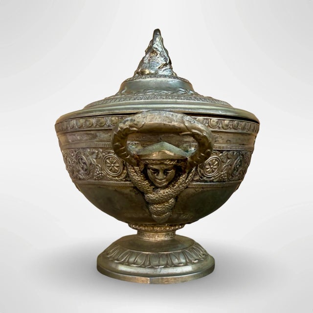 This vintage silver-plated tureen, likely crafted by Corbell & Co., is a stunning example of classic tableware....