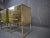 Pair of brass nightstands with black opaline top and 2 drawers. The sides and front are decorated with circular hammered...