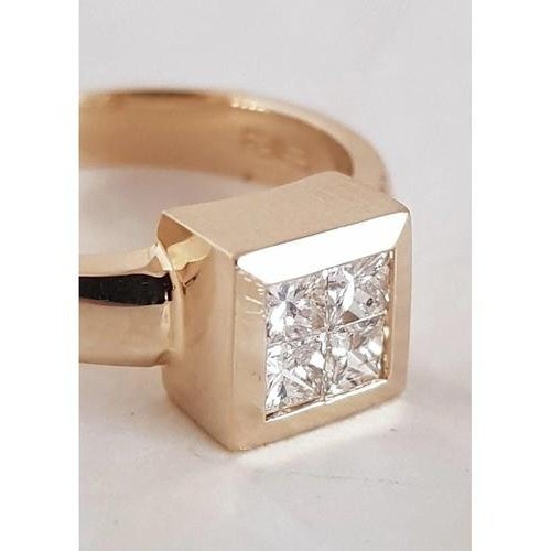 A striking vintage ring crafted in rich 14-carat yellow gold and set with four brilliant princess-cut diamonds arranged in...
