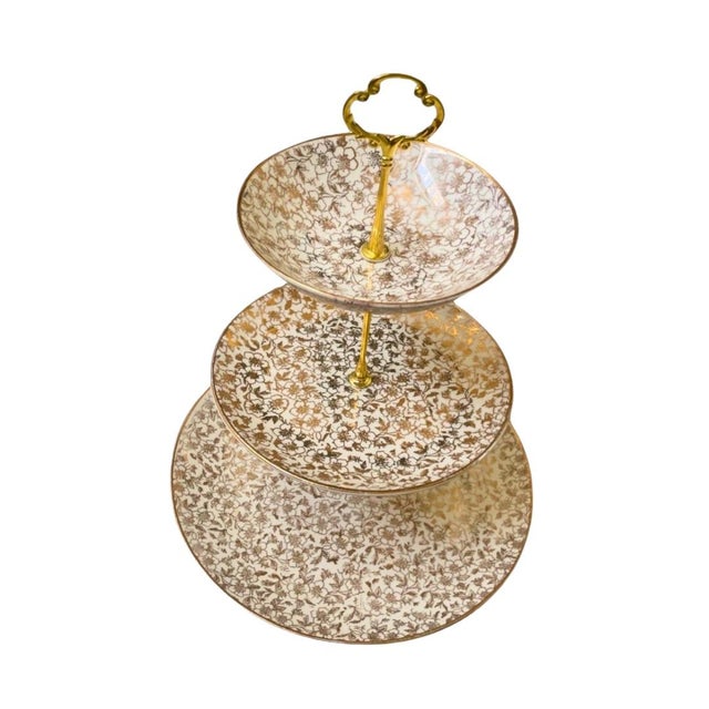 Three tier tidbit serving platter by Homer Laughlin in the Karol pattern, and Rhythm shape. The bottom and middle layers...