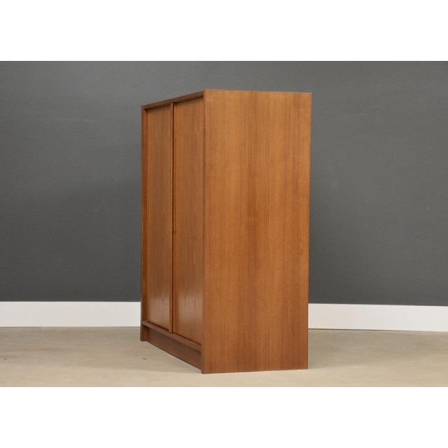 A mid century modern teak armoire dresser. Minor discoloration on side shown in photo. Made in Denmark. Circa 1970’s....