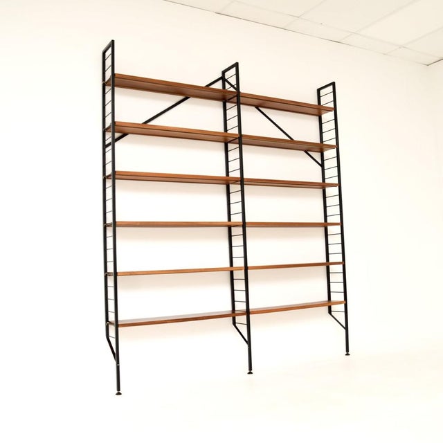 A very stylish and practical vintage teak ladderax bookcase shelving unit. This was made in England, it dates from the...