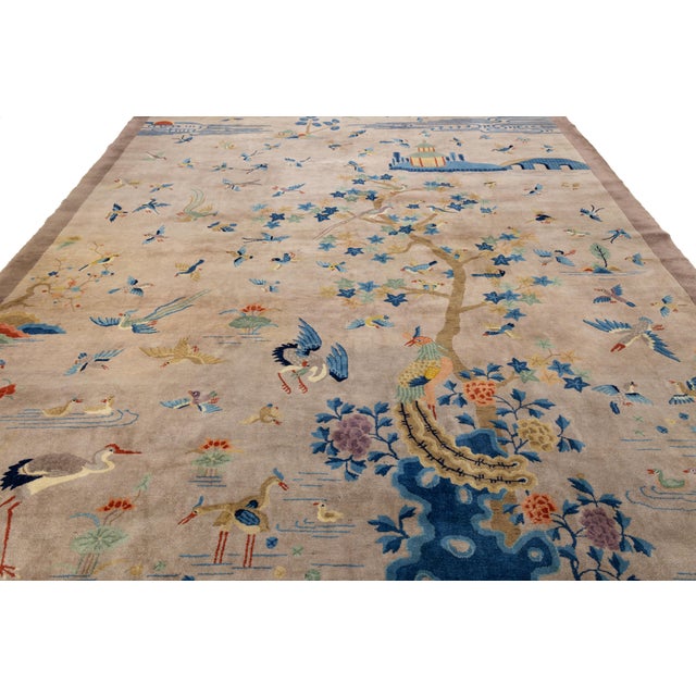 This exquisite antique Chinese wool rug is a masterpiece of early 20th-century craftsmanship, blending traditional Eastern...
