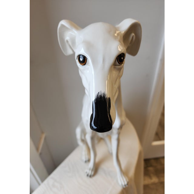 A handsome mid-century Italian glazed ceramic seated greyhound / whippet dog standing 22" tall. Beautiful craftmanship and...