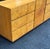 Mid century modern credenza by Lane Furniture. Case clad in richly figured burl veneer. Bookmatched grain across the...