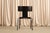 John Hutton designed the Anziano to do something deceptively hard: look light, stack neatly, and still feel substantial...