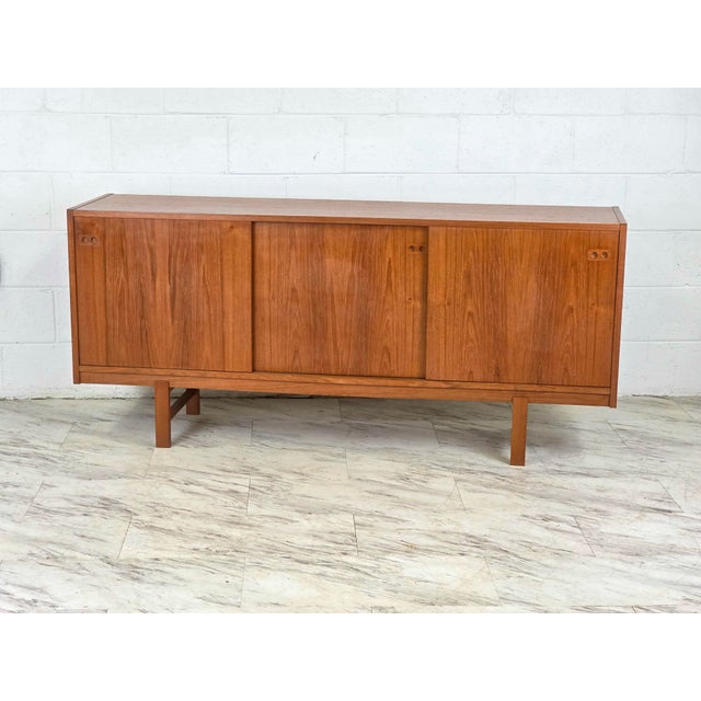 Teak Triple Bay Credenza With 3 Sliding Doors Featuring Built In Solid Teak Pull Holes. 3 Slim Line Drawes & A Solo Cubby...
