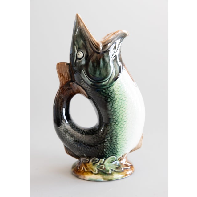 A superb antique English majolica glazed ceramic gurgling fish pitcher or glug jug, circa 1880. Maker's mark on reverse....