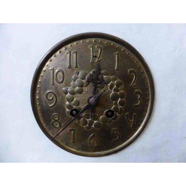 Ceramic and enamel clock in grey and beige tones, rectangular shape with the representation of a woman and a child, signed...