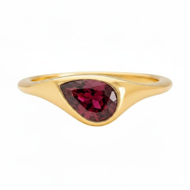 Pear Garnet East-West Ring. Garnet Solitaire Ring. Metal: 14k yellow gold Weight: 2.2 g, depends on size. Main stone:...
