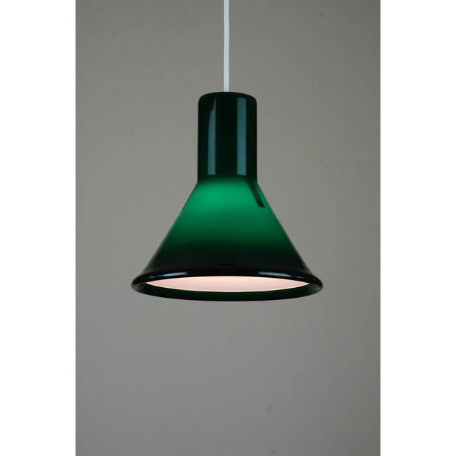 Inspiration from the old-fashioned office lamps. Originally in green, later added in opal, eggplant. Blue was available in...