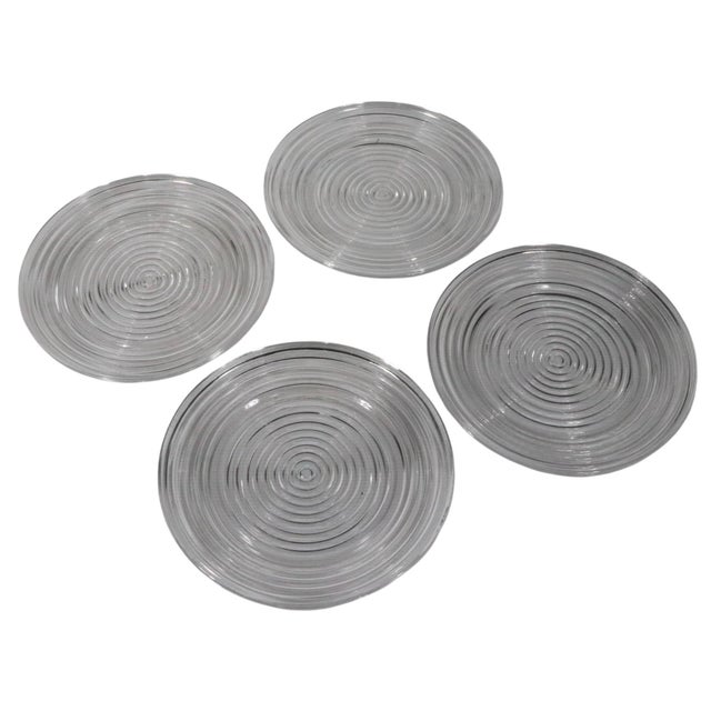 Lot of four Manhattan pattern dinner plates, by Anchor Hocking. The clear glass plates feature dimensional ribs, which...