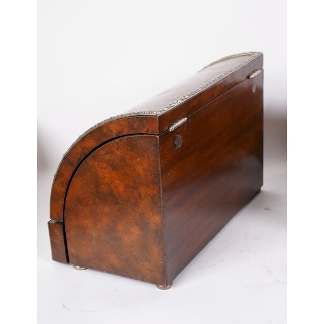 An exceptional Maitland-Smith burl wood roll top document box, crafted in the Regency tradition and finished with finely...